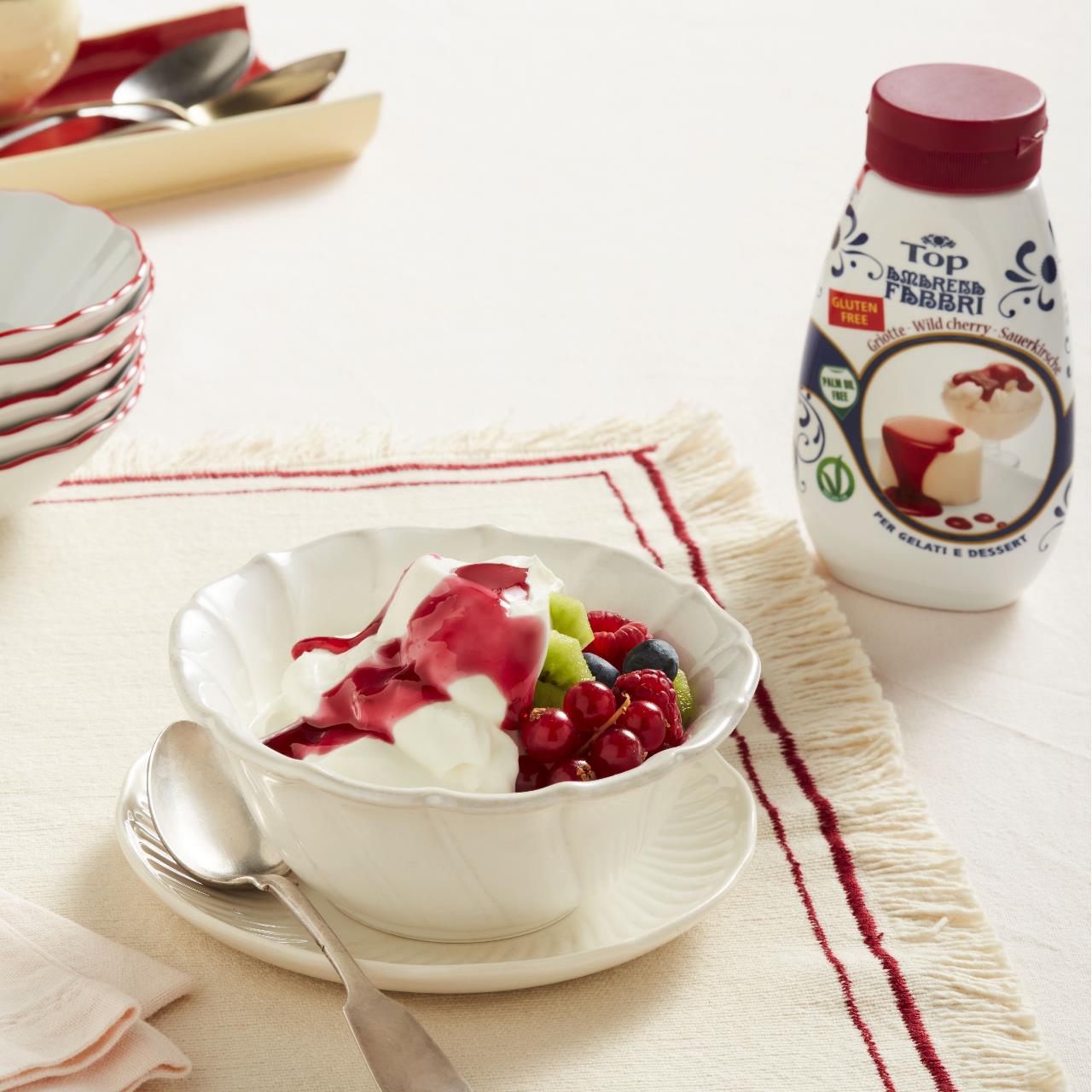Yoghurt cup with fresh fruit and Amarena Fabbri Topping